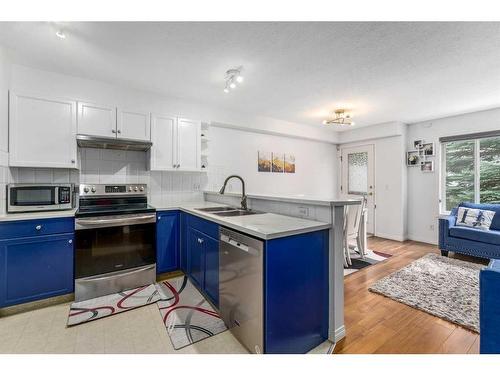 38 Chaparral Ridge Terrace Se, Calgary, AB - Indoor Photo Showing Kitchen With Double Sink