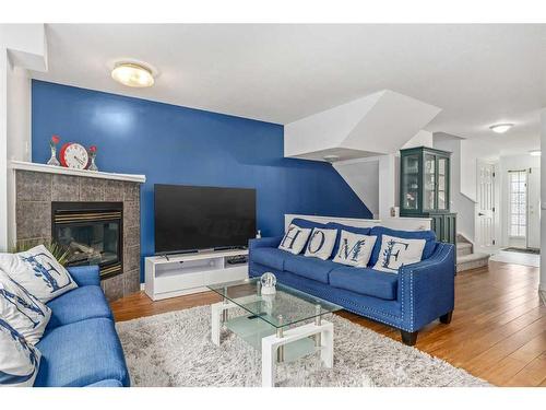 38 Chaparral Ridge Terrace Se, Calgary, AB - Indoor Photo Showing Living Room With Fireplace