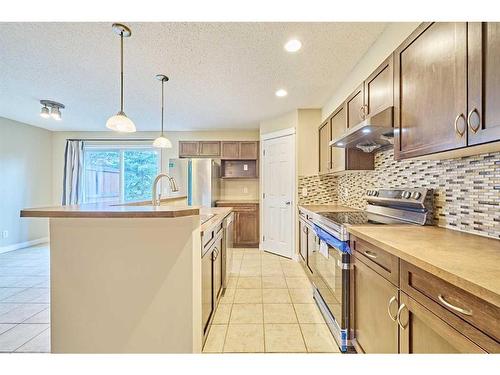 99 Panatella Park Nw, Calgary, AB - Indoor Photo Showing Kitchen With Upgraded Kitchen