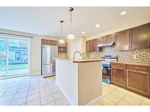 99 Panatella Park Nw, Calgary, AB - Indoor Photo Showing Kitchen With Upgraded Kitchen