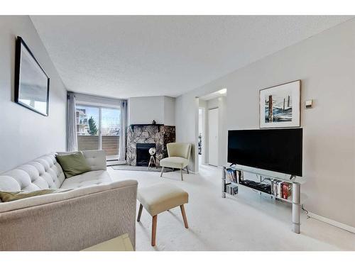 208-2218 30 Street Sw, Calgary, AB - Indoor Photo Showing Living Room With Fireplace