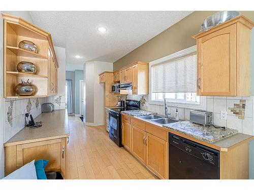 3 Bridleridge View Sw, Calgary, AB - Indoor Photo Showing Kitchen With Double Sink