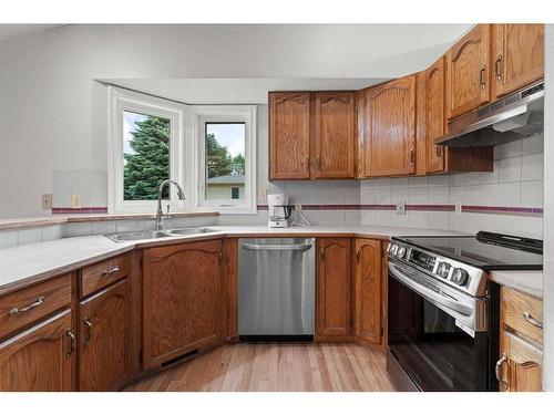 1046 Suncastle Drive Se, Calgary, AB - Indoor Photo Showing Kitchen With Double Sink