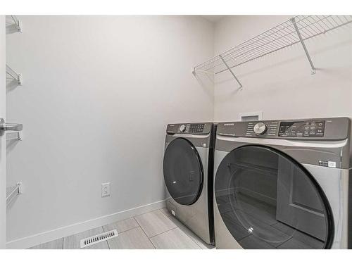 206 Lucas Close Nw, Calgary, AB - Indoor Photo Showing Laundry Room