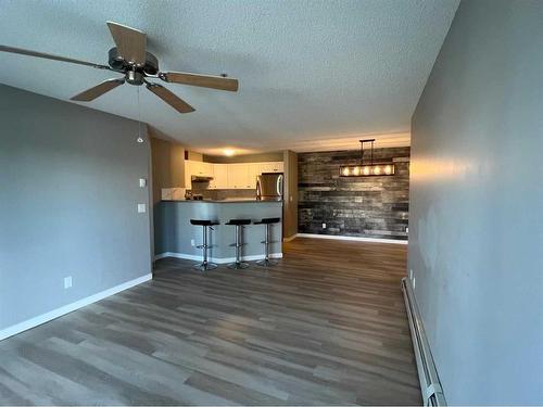 1207-8810 Royal Birch Boulevard Nw, Calgary, AB - Indoor Photo Showing Kitchen With Stainless Steel Kitchen With Double Sink