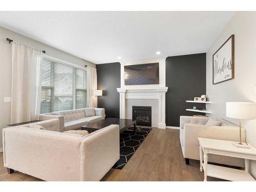 115 Cranbrook Hill Se, Calgary, AB - Indoor Photo Showing Living Room With Fireplace