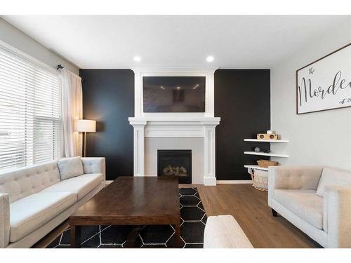115 Cranbrook Hill Se, Calgary, AB - Indoor Photo Showing Living Room With Fireplace