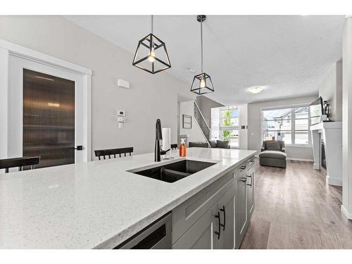 23 Belmont Gardens Sw, Calgary, AB - Indoor Photo Showing Kitchen With Double Sink With Upgraded Kitchen