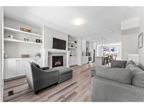 23 Belmont Gardens Sw, Calgary, AB - Indoor Photo Showing Living Room With Fireplace