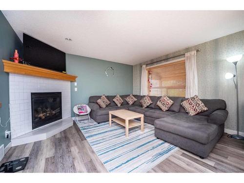 1953 New Brighton Drive Se, Calgary, AB - Indoor Photo Showing Living Room With Fireplace