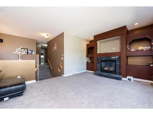 1953 New Brighton Drive Se, Calgary, AB - Indoor Photo Showing Living Room With Fireplace