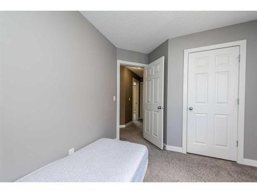 1953 New Brighton Drive Se, Calgary, AB - Indoor Photo Showing Bedroom