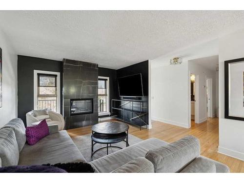 3727 Kerrydale Road Sw, Calgary, AB - Indoor Photo Showing Living Room With Fireplace