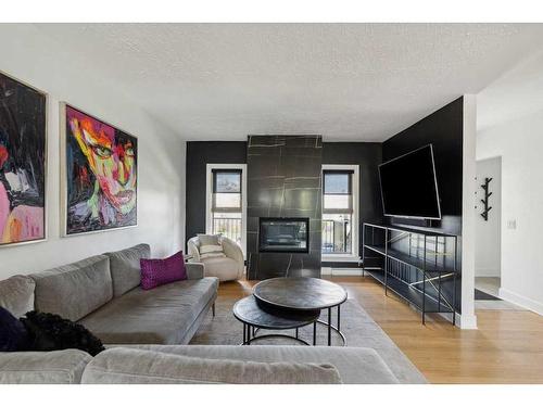 3727 Kerrydale Road Sw, Calgary, AB - Indoor Photo Showing Living Room With Fireplace