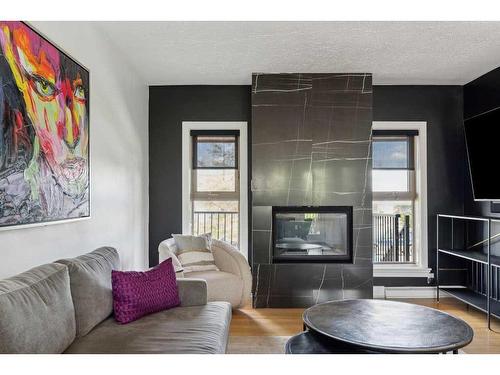 3727 Kerrydale Road Sw, Calgary, AB - Indoor Photo Showing Living Room With Fireplace