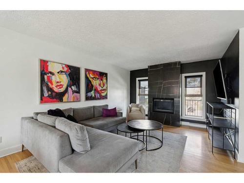 3727 Kerrydale Road Sw, Calgary, AB - Indoor Photo Showing Living Room With Fireplace