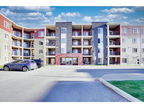 205-15 Saddlestone Way Ne, Calgary, AB - Outdoor With Balcony With Facade