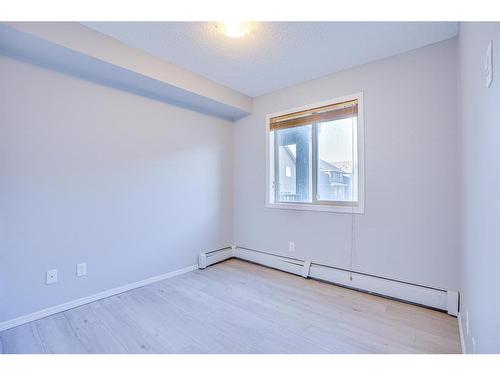 205-15 Saddlestone Way Ne, Calgary, AB - Indoor Photo Showing Other Room