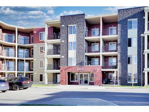 205-15 Saddlestone Way Ne, Calgary, AB - Outdoor With Balcony With Facade