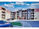 205-15 Saddlestone Way Ne, Calgary, AB  - Outdoor With Balcony With Facade 