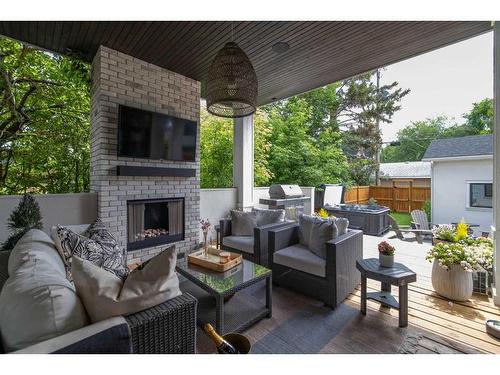 2711 7 Avenue Nw, Calgary, AB - Outdoor With Fireplace With Deck Patio Veranda With Exterior