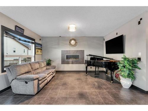 16 Nolanfield Crescent Nw, Calgary, AB - Indoor Photo Showing Living Room With Fireplace