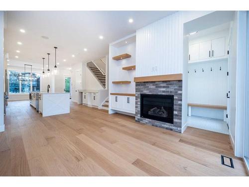 1828 19 Avenue Nw, Calgary, AB - Indoor Photo Showing Living Room With Fireplace