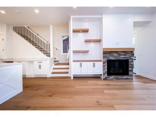 1828 19 Avenue Nw, Calgary, AB - Indoor Photo Showing Living Room With Fireplace