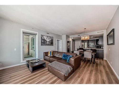 1702-1410 1 Street Se, Calgary, AB - Indoor Photo Showing Living Room