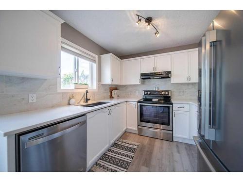 36 Hidden Point Nw, Calgary, AB - Indoor Photo Showing Kitchen With Stainless Steel Kitchen With Double Sink