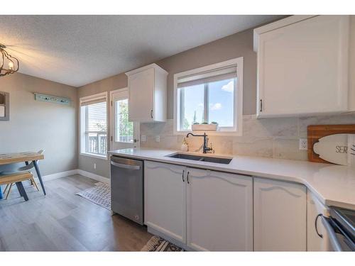36 Hidden Point Nw, Calgary, AB - Indoor Photo Showing Kitchen With Double Sink