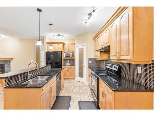 23 Taracove Estate Drive Ne, Calgary, AB - Indoor Photo Showing Kitchen With Double Sink With Upgraded Kitchen