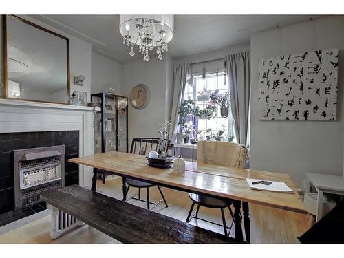 114 7 Avenue Nw, Calgary, AB - Indoor Photo Showing Dining Room With Fireplace