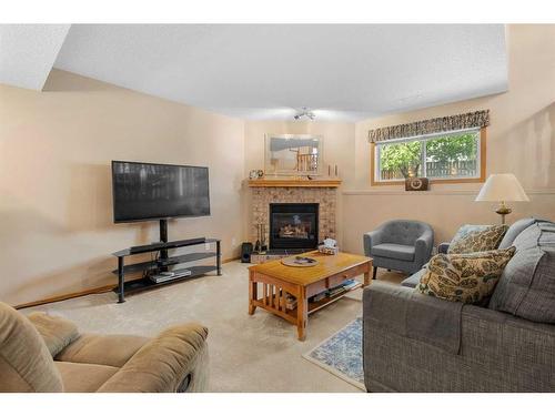 40 Harvest Park Road Ne, Calgary, AB - Indoor Photo Showing Living Room With Fireplace