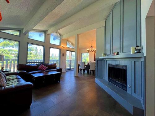 123 Edgepark Boulevard Nw, Calgary, AB - Indoor Photo Showing Living Room With Fireplace