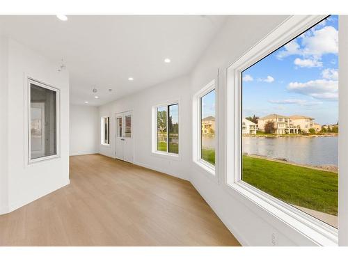 147 Coral Shores Landing Ne, Calgary, AB - Indoor Photo Showing Other Room With Body Of Water