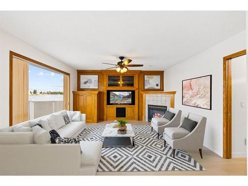 147 Coral Shores Landing Ne, Calgary, AB - Indoor Photo Showing Living Room With Fireplace