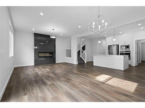 113 Amblehurst Rise Nw, Calgary, AB - Indoor Photo Showing Living Room With Fireplace