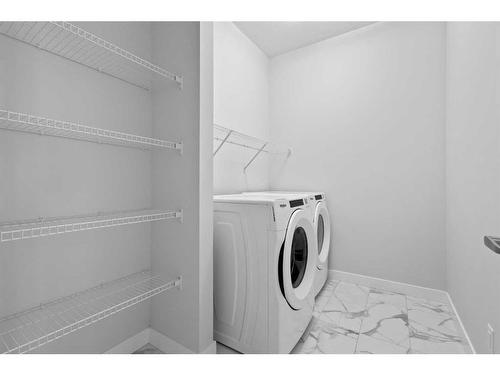 113 Amblehurst Rise Nw, Calgary, AB - Indoor Photo Showing Laundry Room