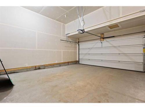 113 Amblehurst Rise Nw, Calgary, AB - Indoor Photo Showing Garage