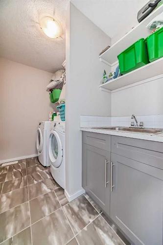 20 Nolancrest Green Nw, Calgary, AB - Indoor Photo Showing Laundry Room