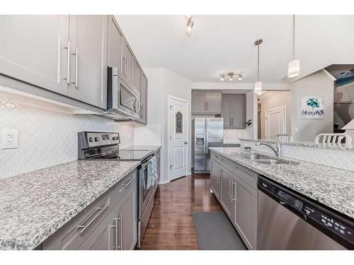 20 Nolancrest Green Nw, Calgary, AB - Indoor Photo Showing Kitchen With Double Sink With Upgraded Kitchen