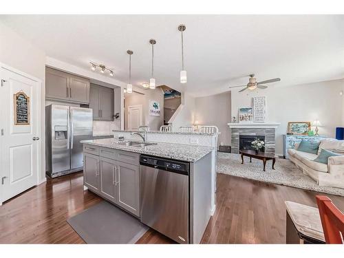 20 Nolancrest Green Nw, Calgary, AB - Indoor Photo Showing Kitchen With Fireplace With Stainless Steel Kitchen With Upgraded Kitchen