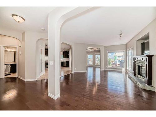 92 Silverado Skies Manor Sw, Calgary, AB - Indoor Photo Showing Other Room With Fireplace