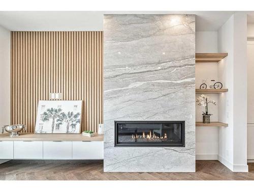 922 33A Street Nw, Calgary, AB - Indoor Photo Showing Living Room With Fireplace