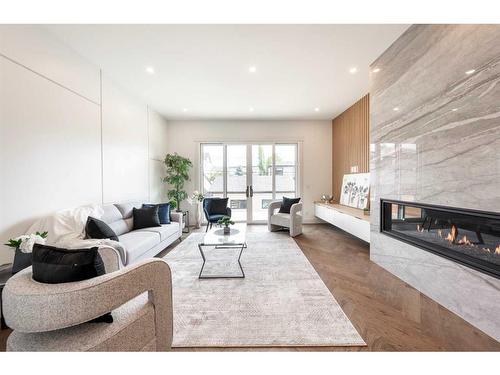 922 33A Street Nw, Calgary, AB - Indoor Photo Showing Living Room With Fireplace