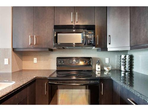 908-210 15 Avenue Se, Calgary, AB - Indoor Photo Showing Kitchen With Upgraded Kitchen