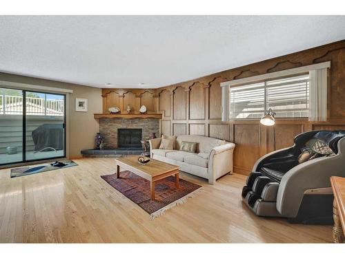 68 Millward Place Ne, Calgary, AB - Indoor Photo Showing Living Room With Fireplace