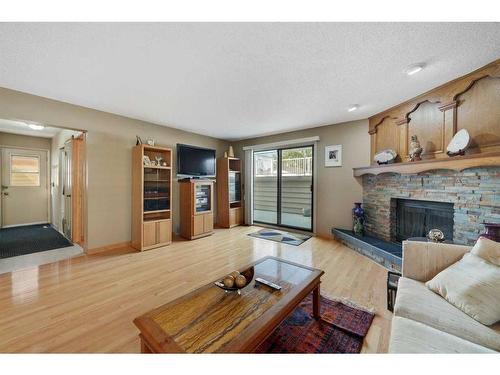 68 Millward Place Ne, Calgary, AB - Indoor Photo Showing Living Room With Fireplace