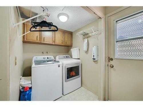 68 Millward Place Ne, Calgary, AB - Indoor Photo Showing Laundry Room